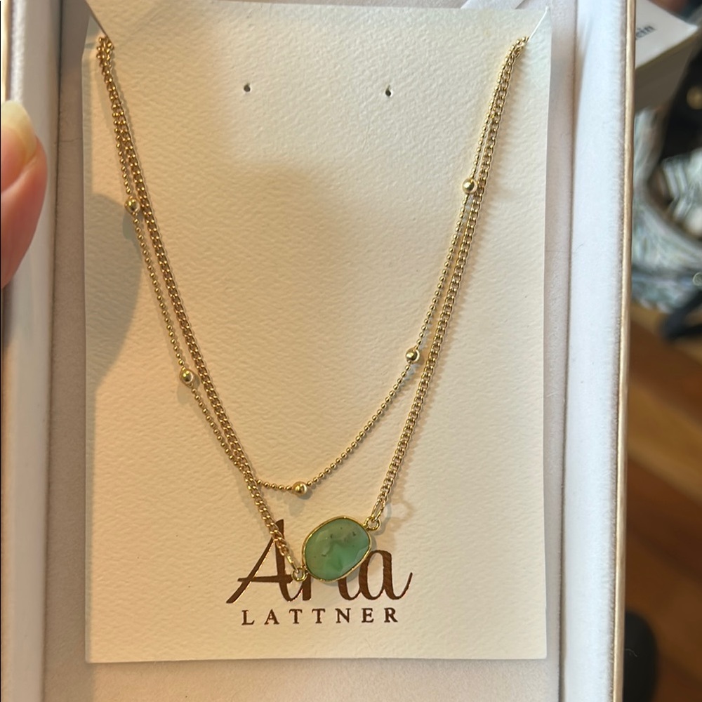Aria Lattnrr Gold Tone Necklace with aqua stone.